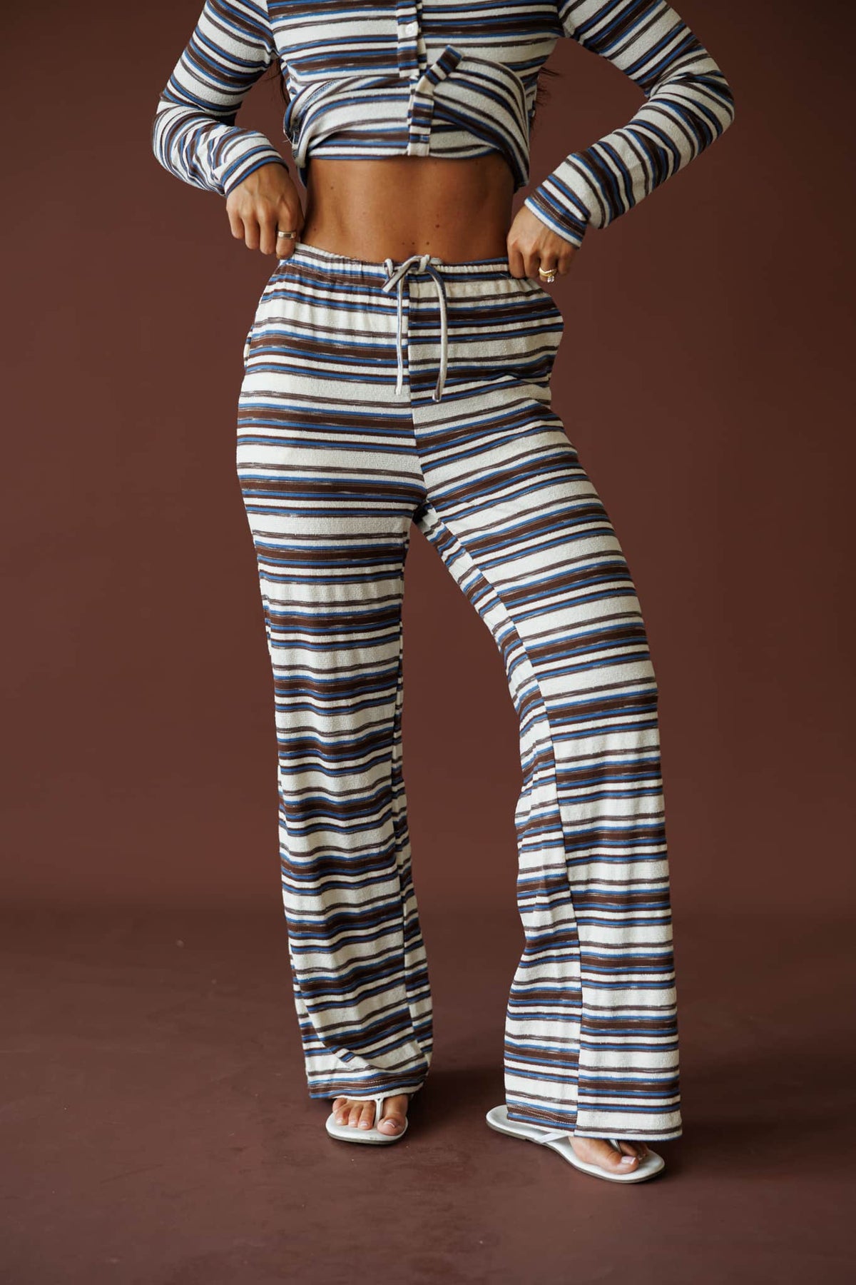 Slow Mornings Pant in blue brown stripe, front close-up of the drawstring waist