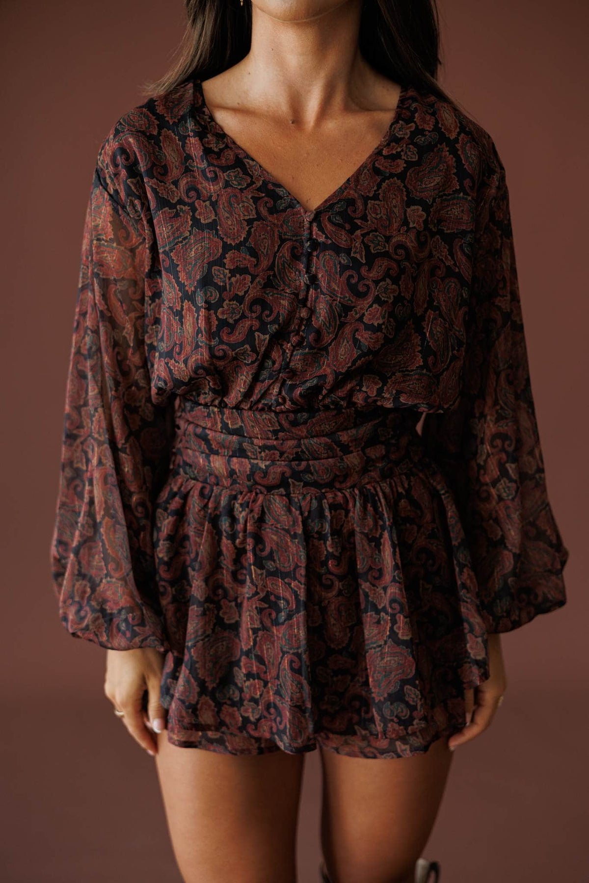 Sonora Paisley Romper in black, front close-up of the elastic waist and paisley chiffon