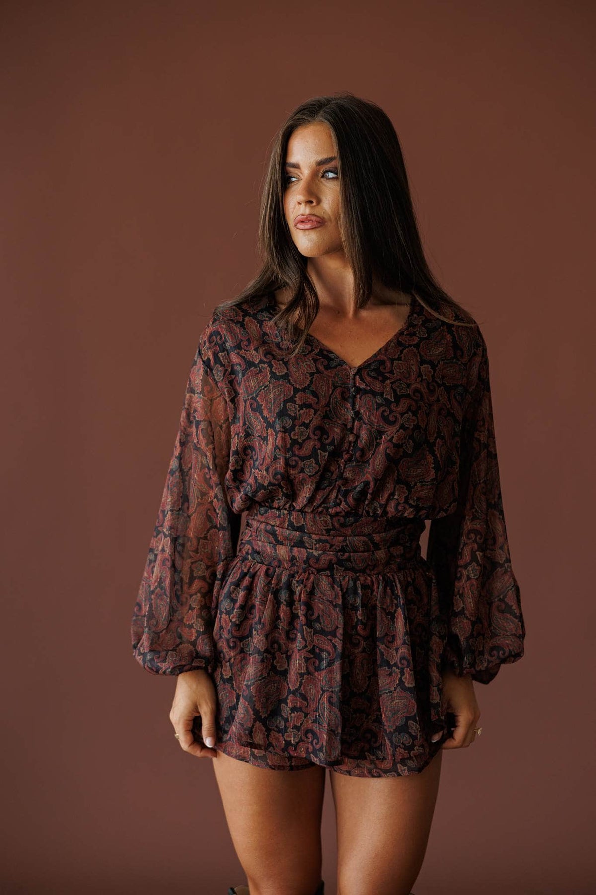 Sonora Paisley Romper in black, front view showing the V neck and balloon sleeves