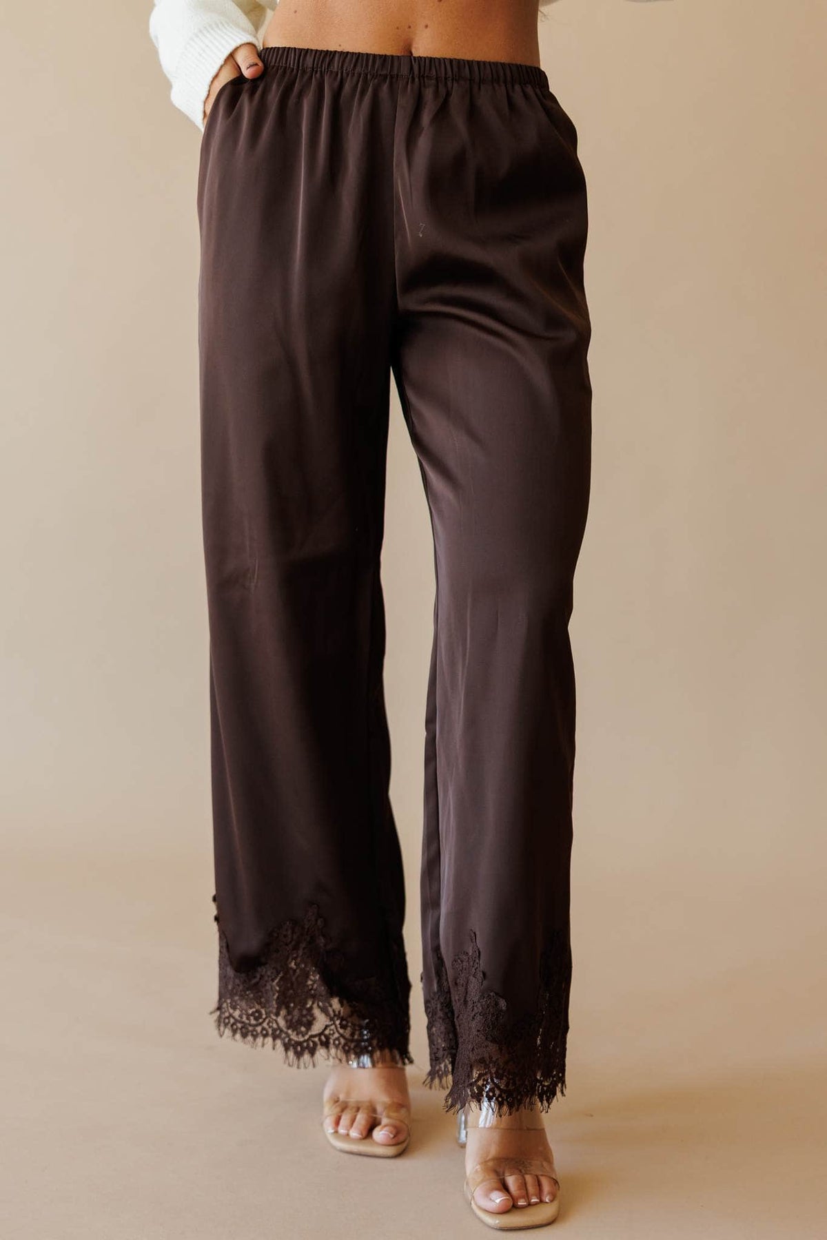 Dark brown satin wide leg pants with lace hem, front view