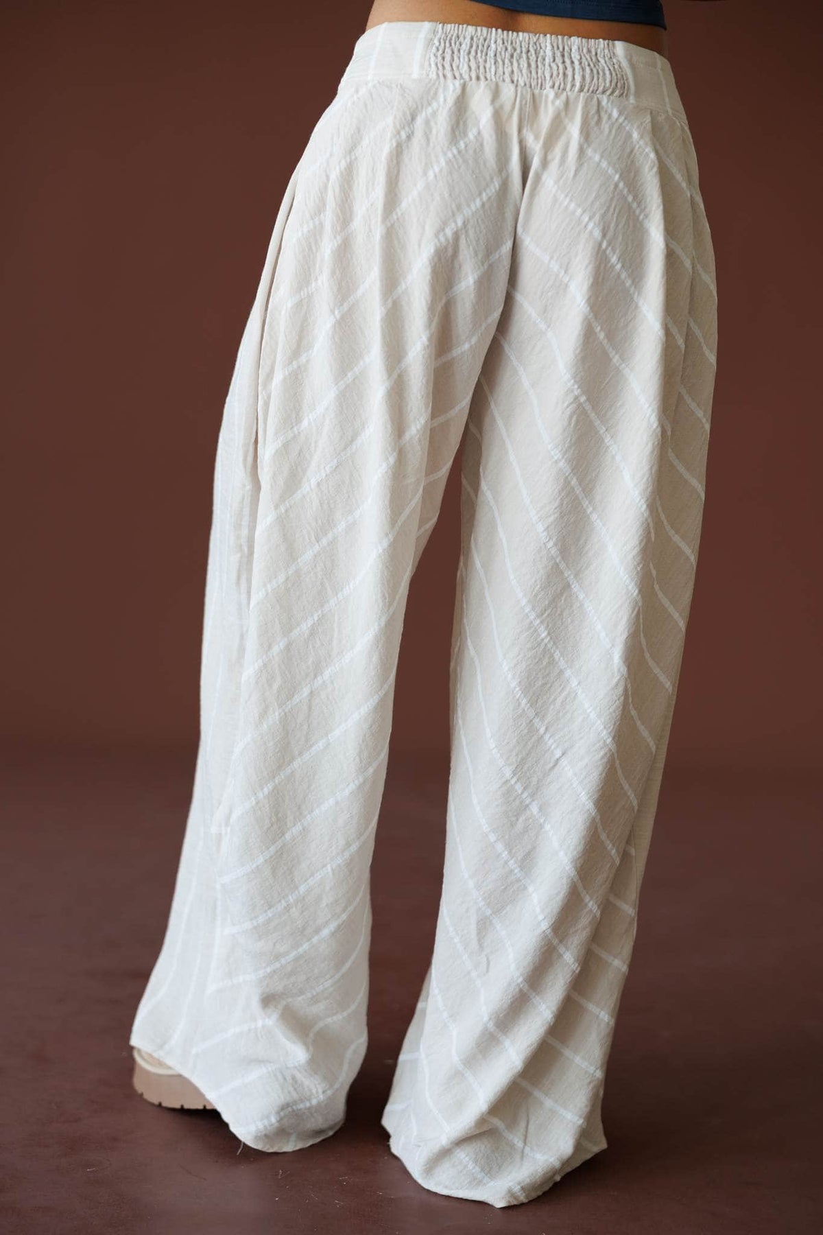 Sunroom Linen Wide Leg Pant in taupe, back view showing the elastic waist and wide leg
