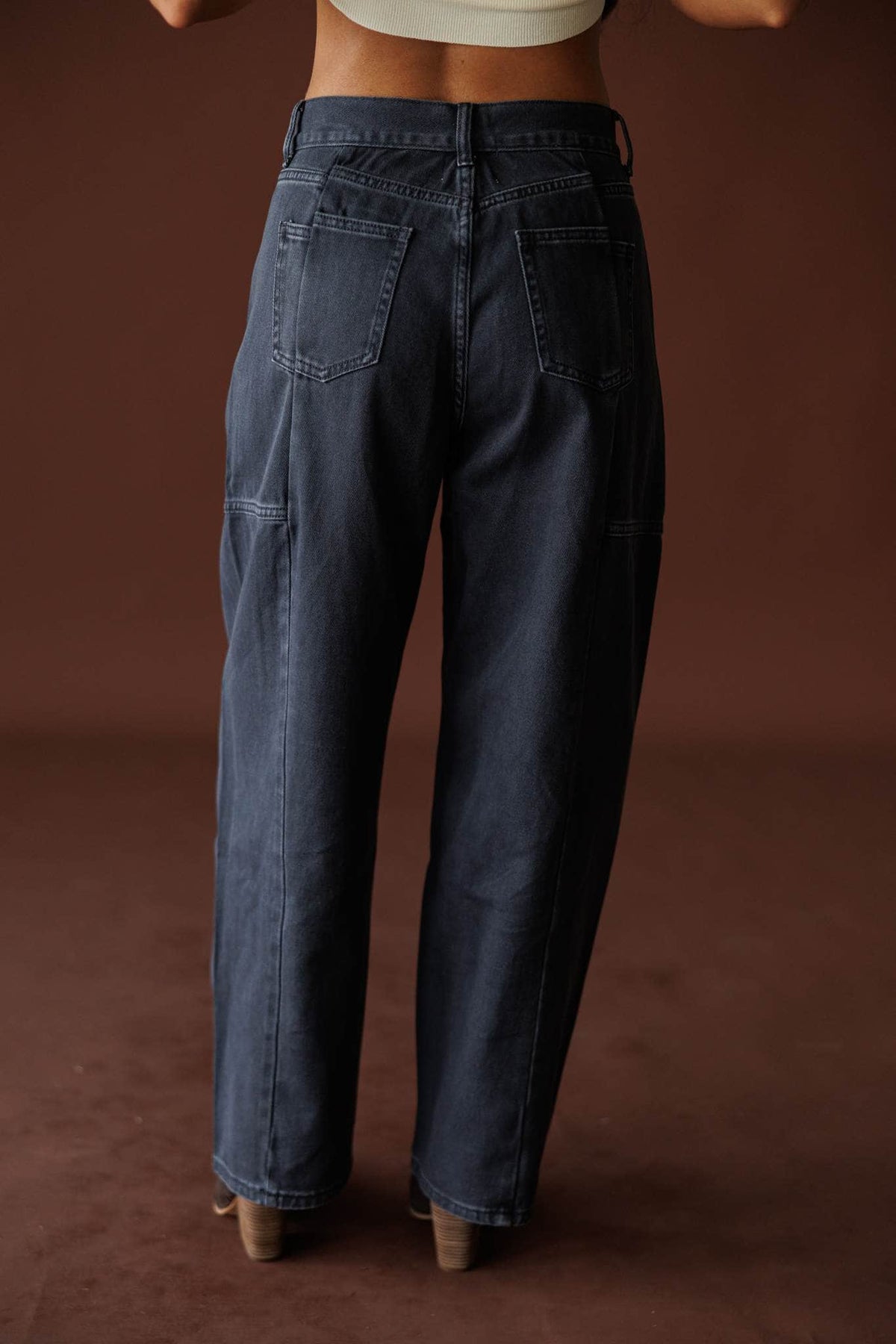 Midnight Barrel Jeans in black, front view showing the barrel leg black jeans