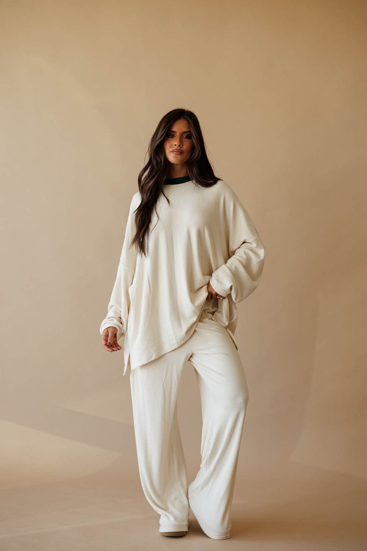 Cream oversized knit top with side slit