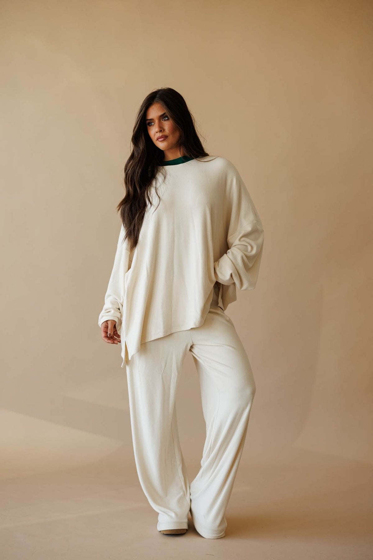 Cream oversized knit top with side slit, front view