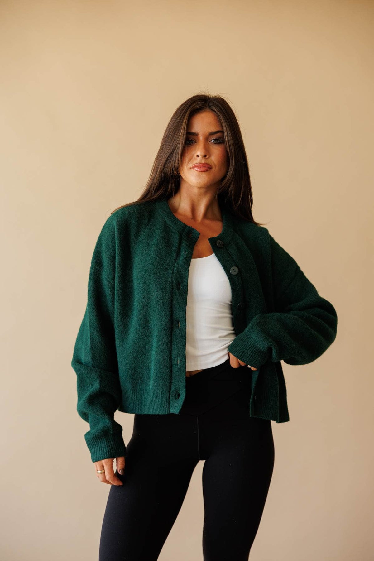 Forest green button front cardigan, front view