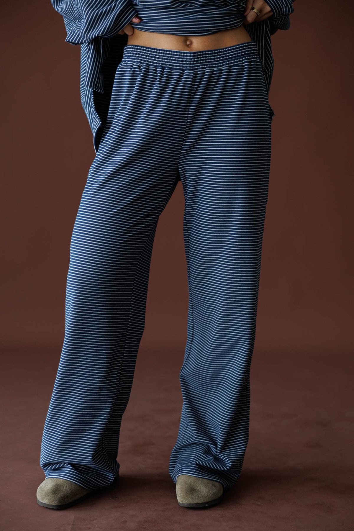 The Social Club Fleece Pants in navy, front close-up of the elastic waist ribbed fleece