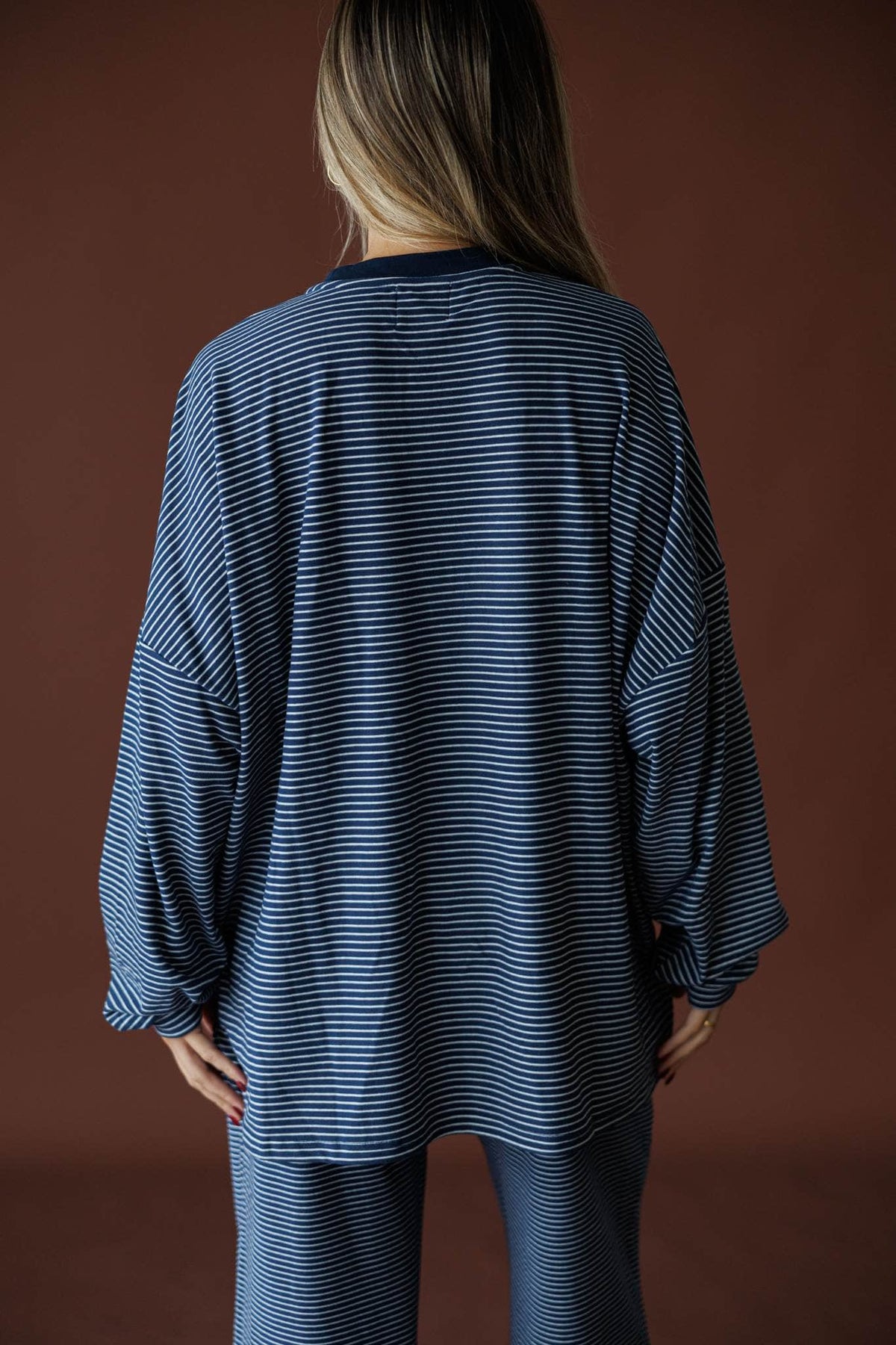 The Social Club Fleece Top in navy, side view showing the oversized ribbed fleece top