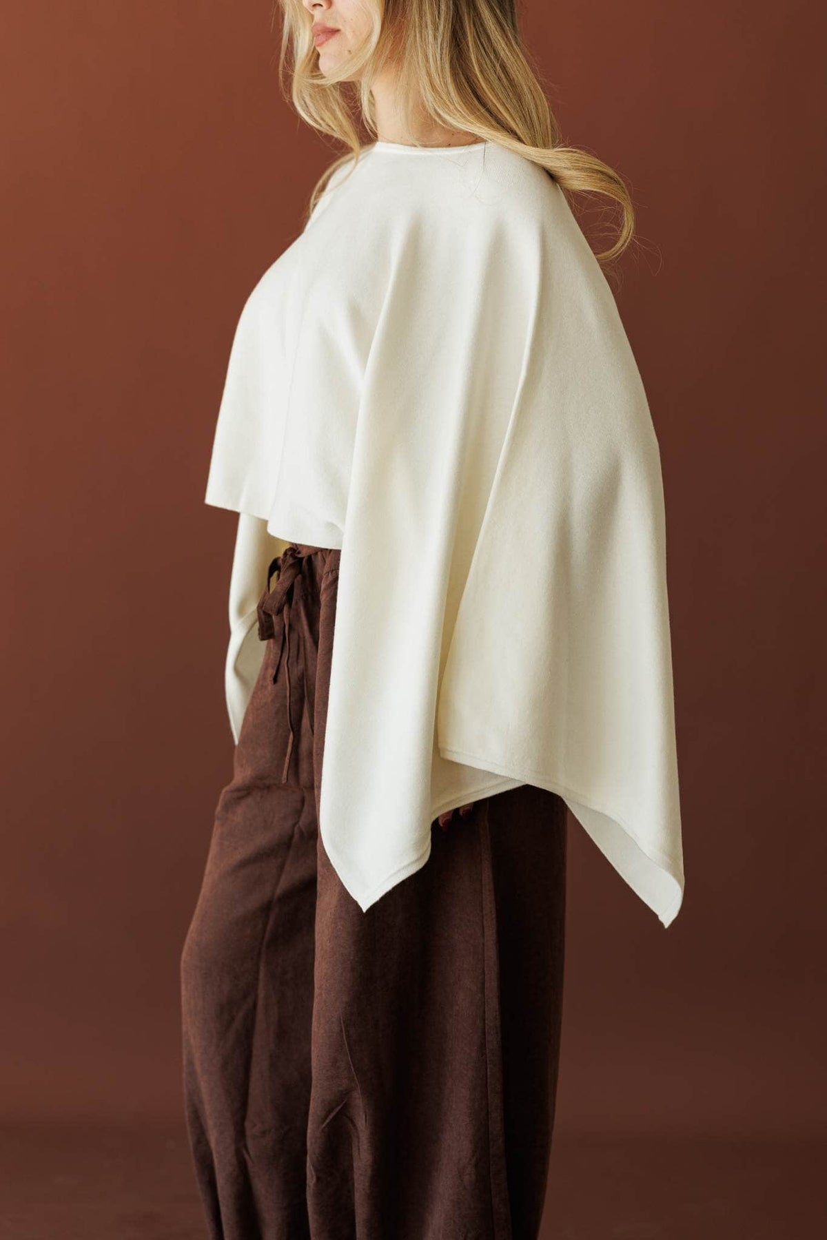 Wide Open Boat Neck Sweater, in cream, side view of the dolman sleeve