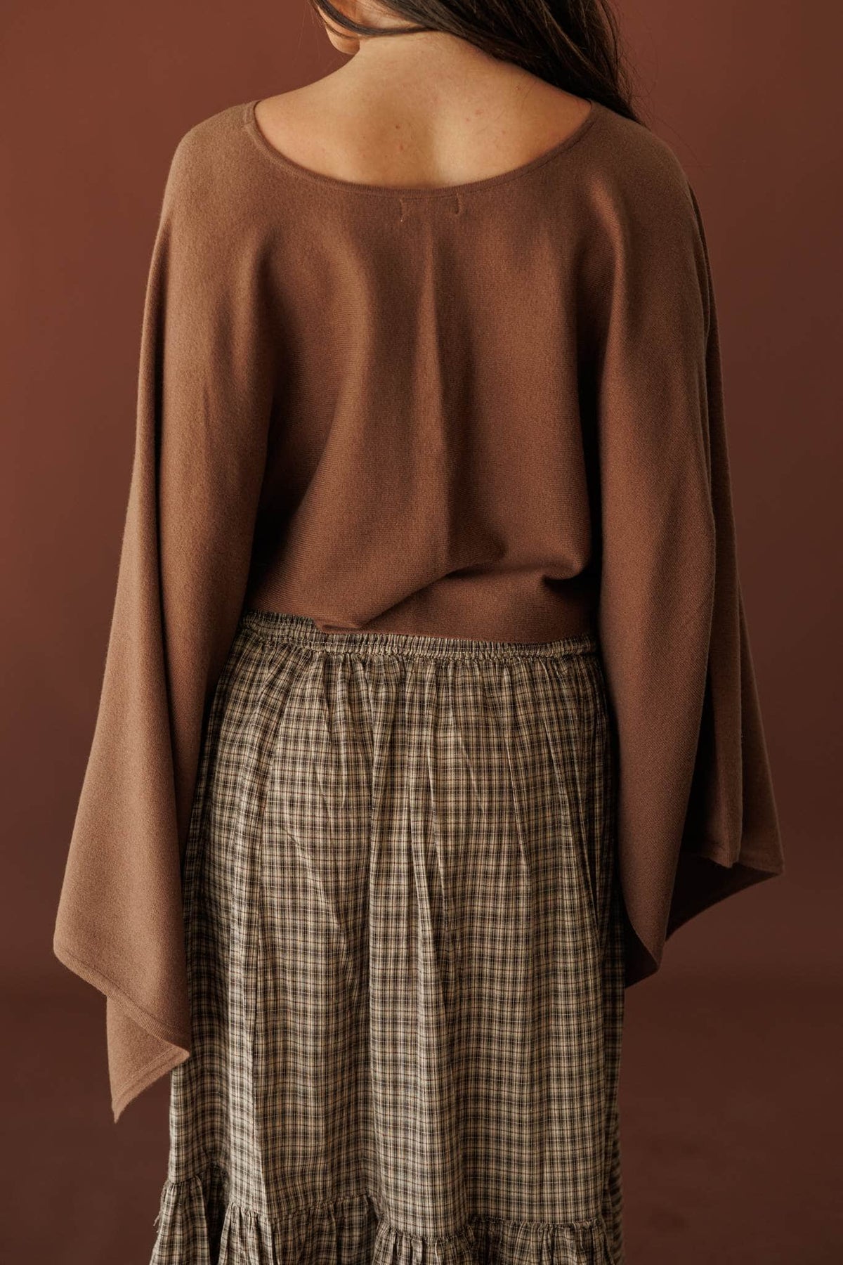 Wide Open Boat Neck Sweater, in brown, back view of the cropped body
