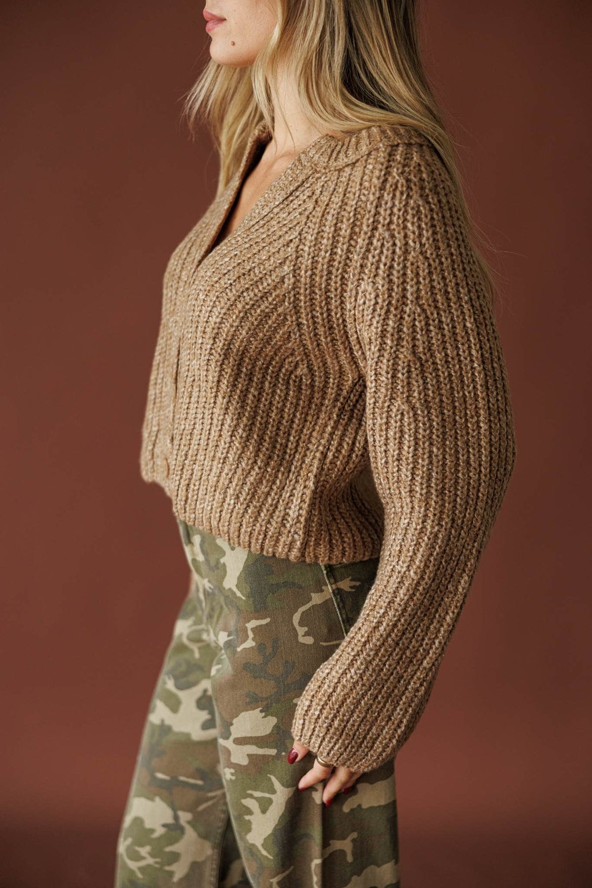 Cedar House Cardigan in sand, side view with the drop-shoulder sleeve