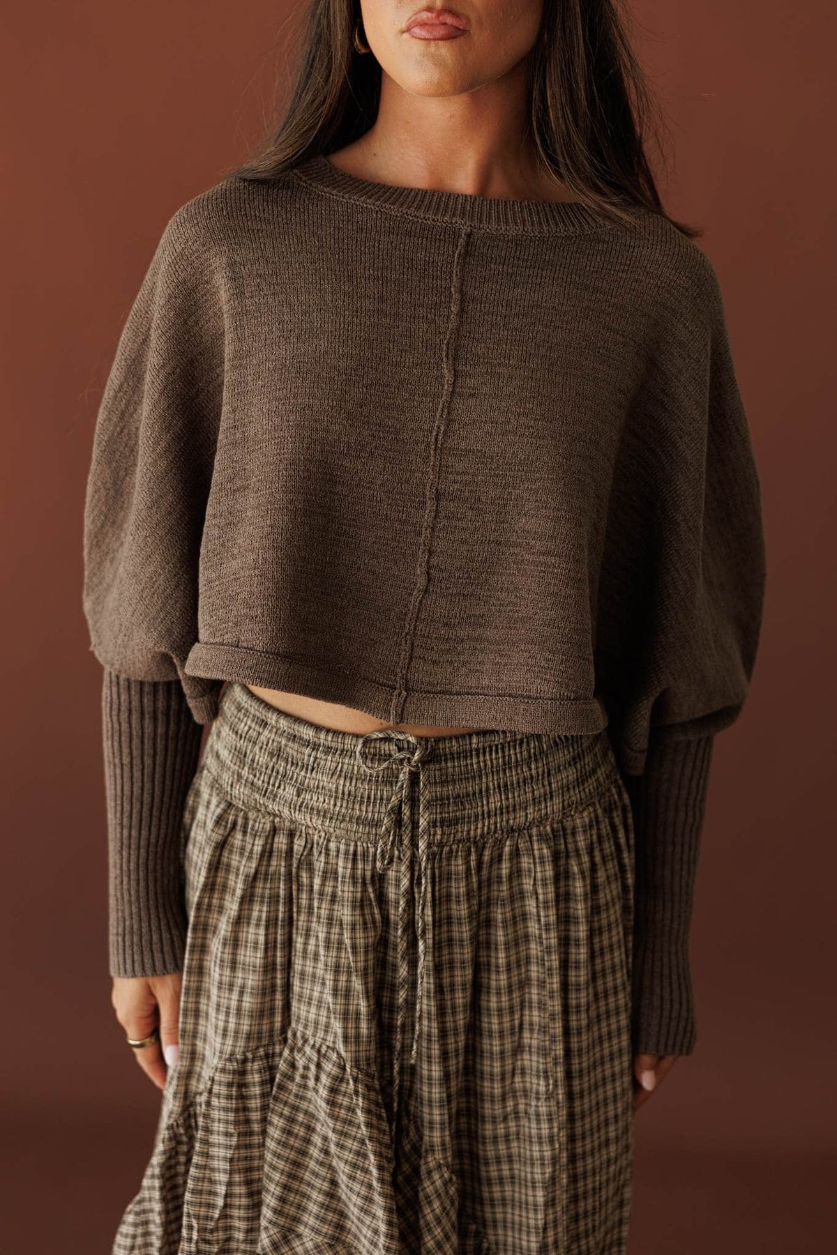Quiet Morning Mock Neck Sweater, in stone, front view with a checked skirt