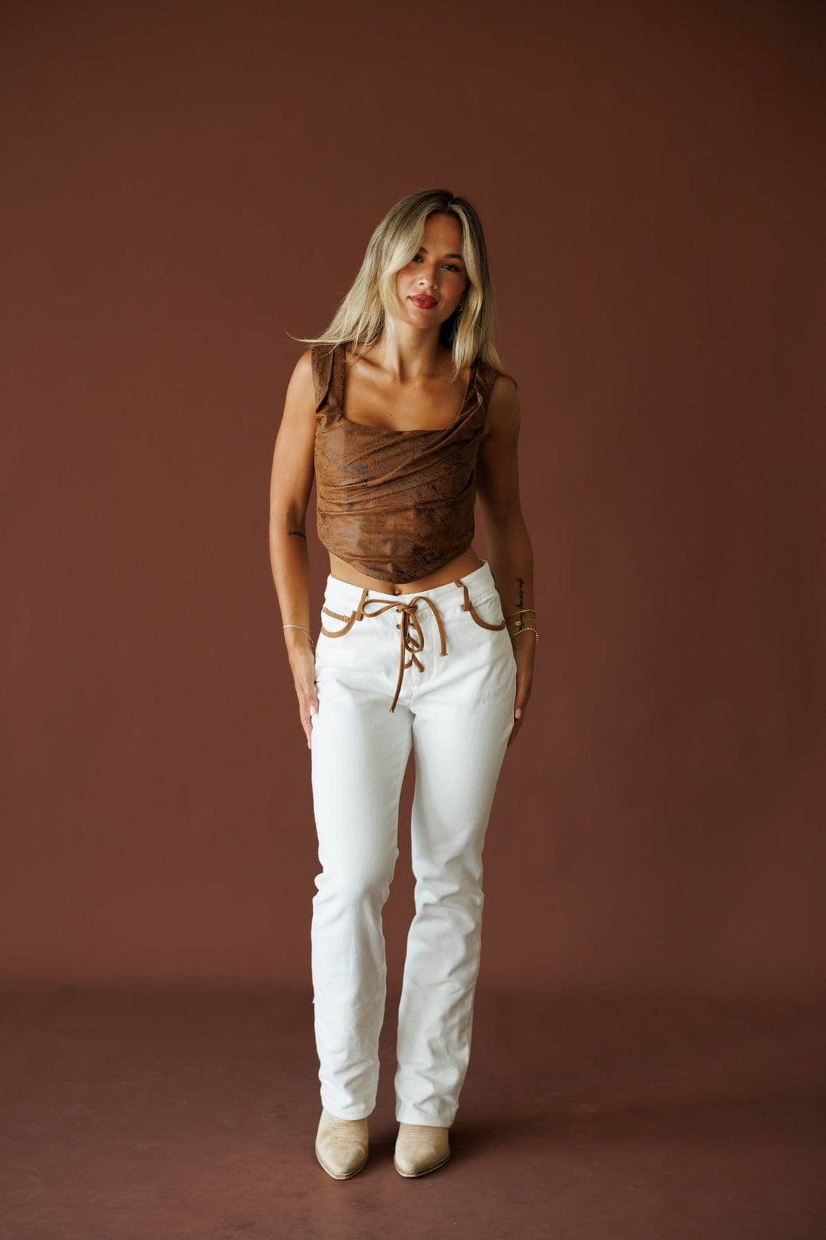 West Coast Wild Jeans in ivory, full-length view with a brown ruched top