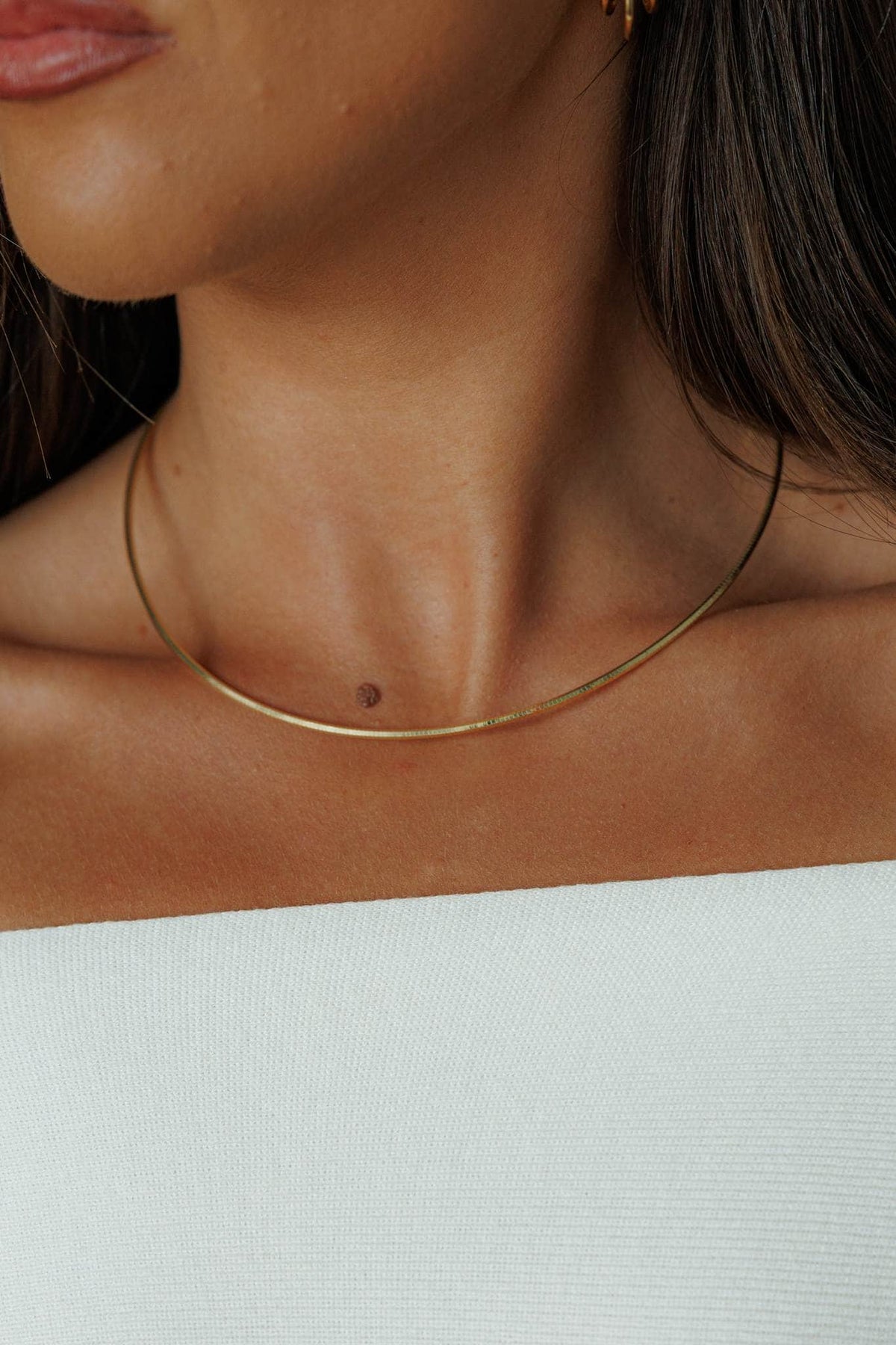 Gold Collar Necklace, worn at the base of the neck