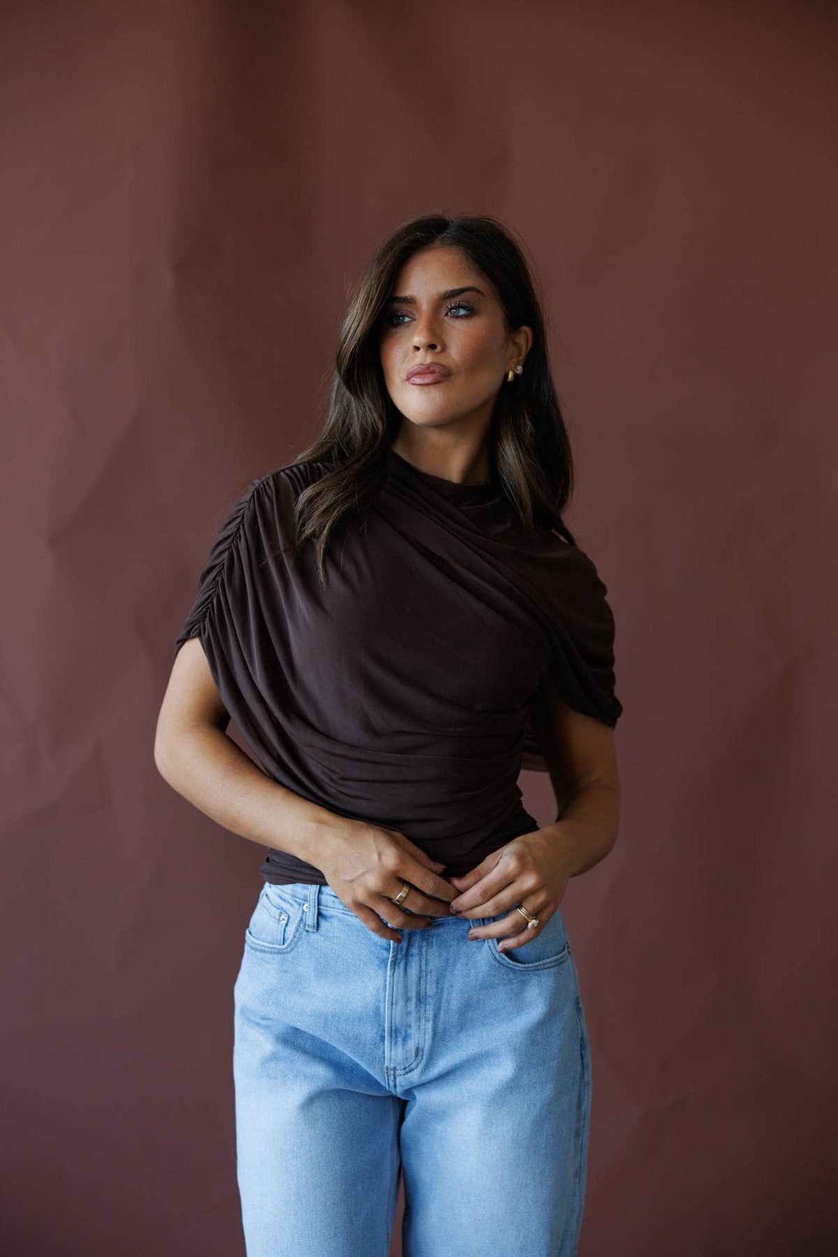 Brown draped asymmetric cape top, front view