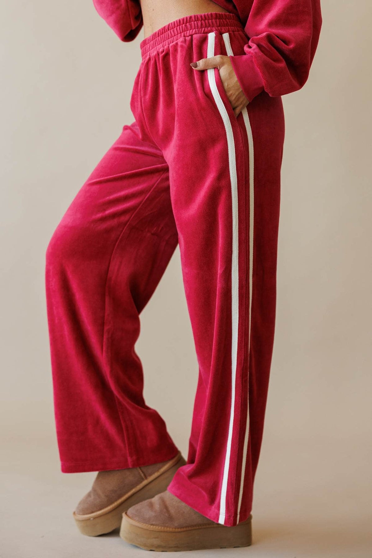 Berry velour track pants with side stripe, front view