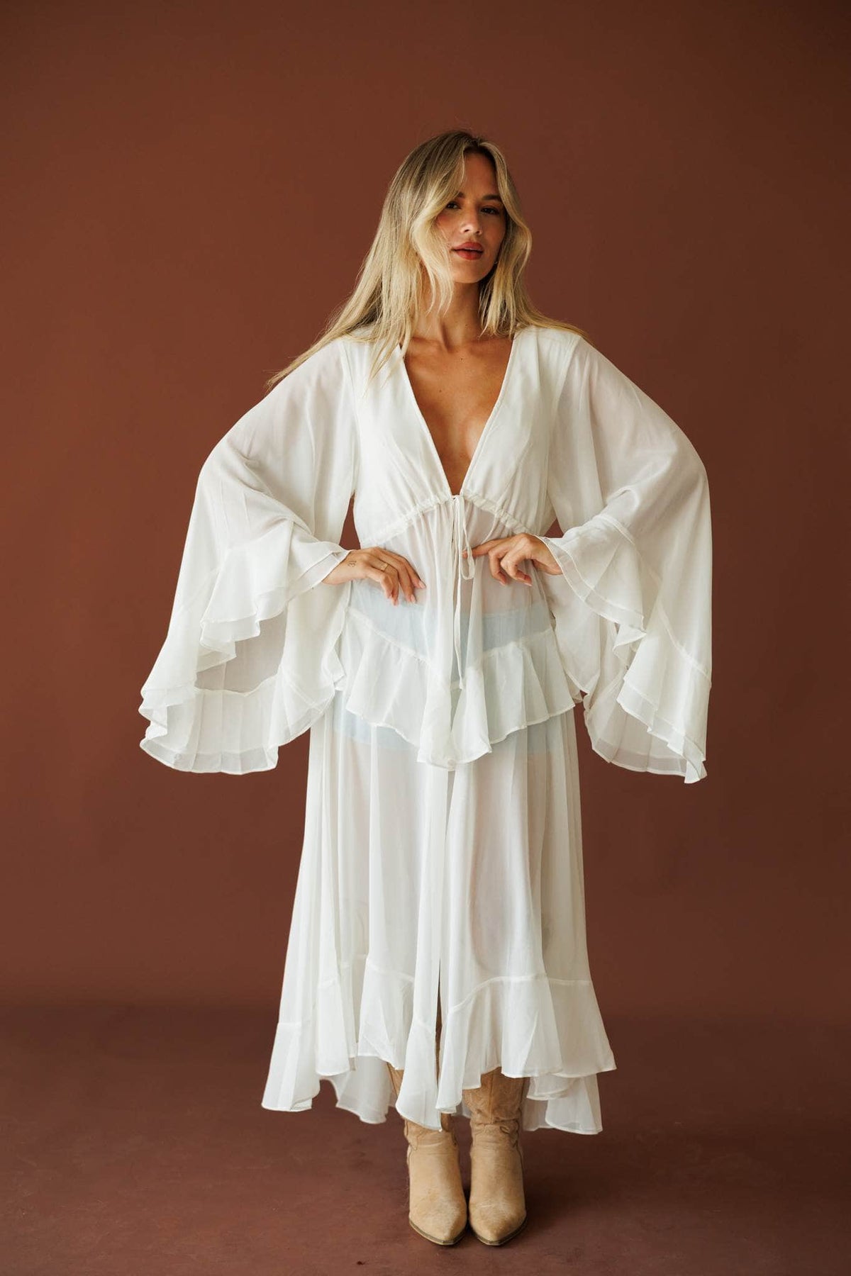 Desert Angel Duster in cream, full-length view on model with tall boots