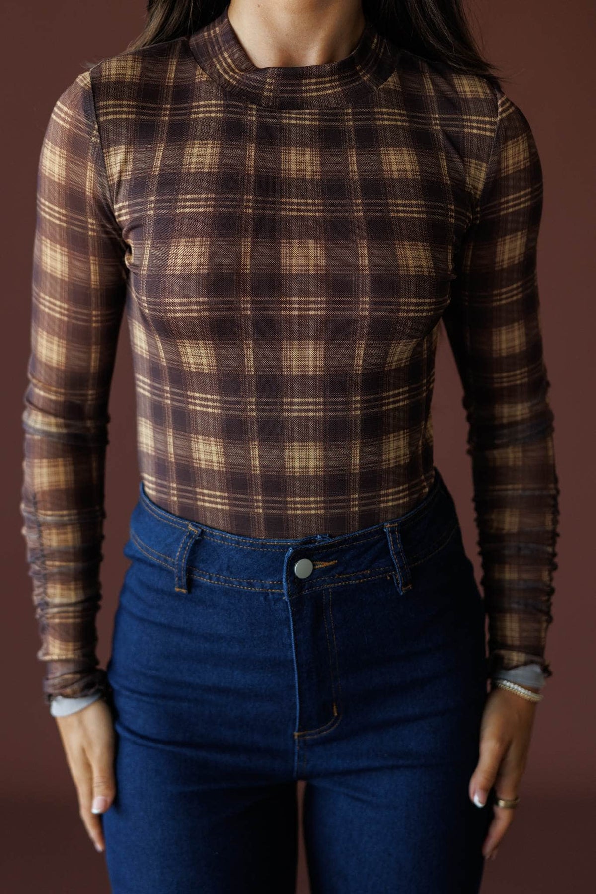 Bookmarked Plaid Mesh Bodysuit in brown and butter, front close-up of the mock neck and plaid