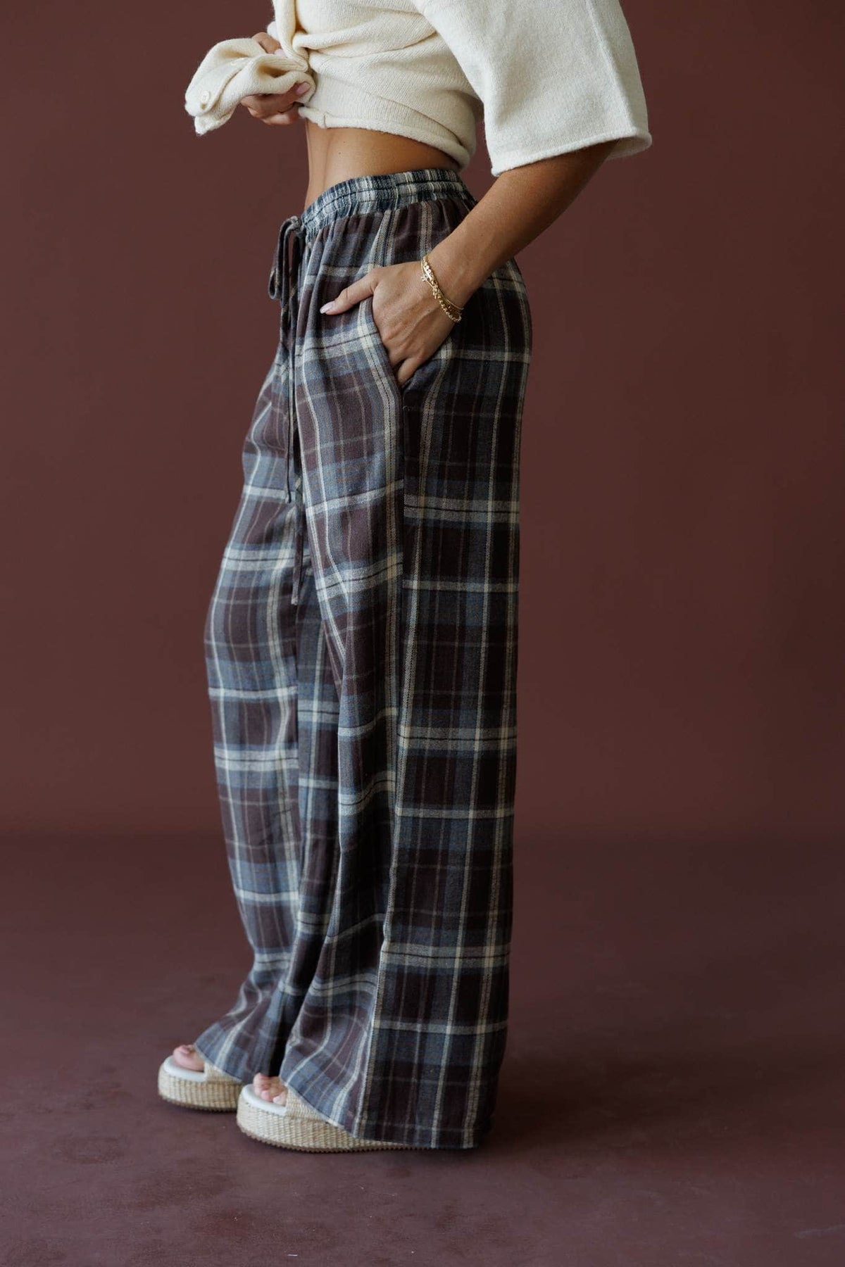 Brown Plaid Boxer Pants in brown, side view showing the pocket and plaid pattern