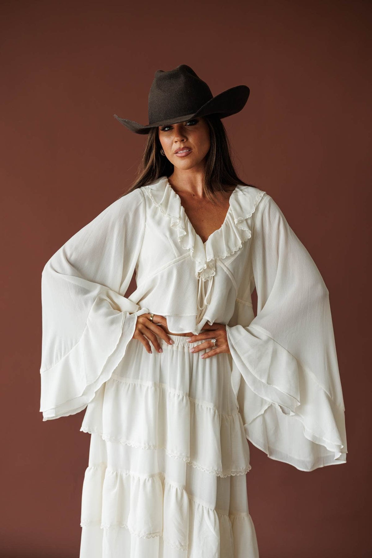 Cream ruffle V neck blouse, front view