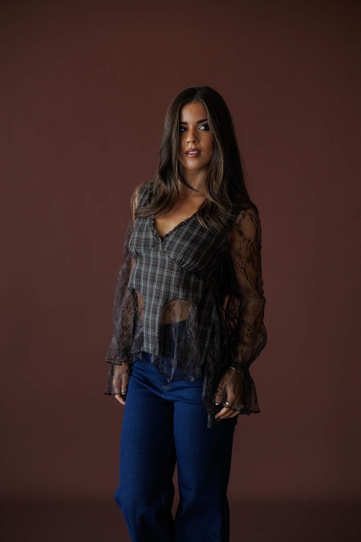 Chocolate Plaid Lace Mixed Top in chocolate, front view on model with hand at the waist
