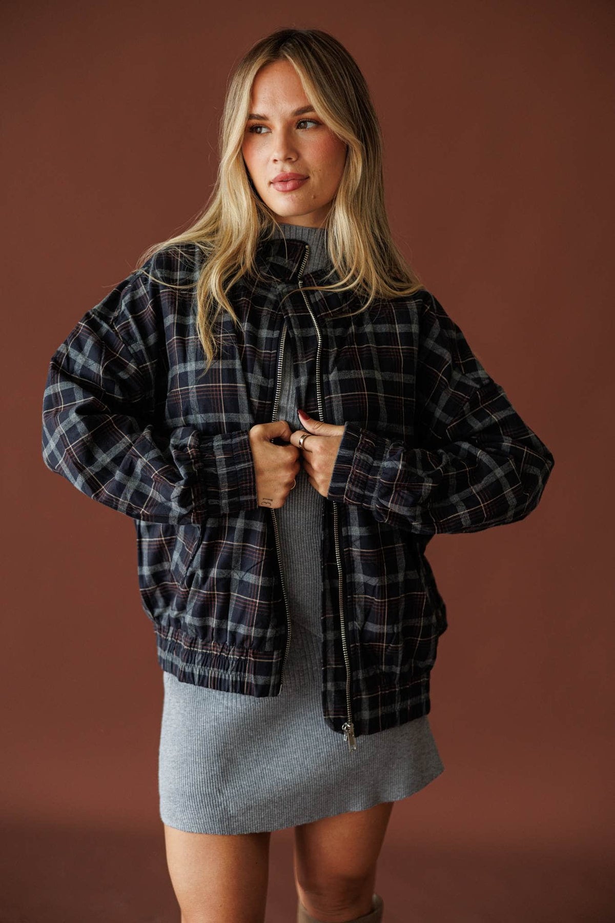 Homecoming Plaid Bomber Jacket in navy multi, front view worn open over a grey mini dress
