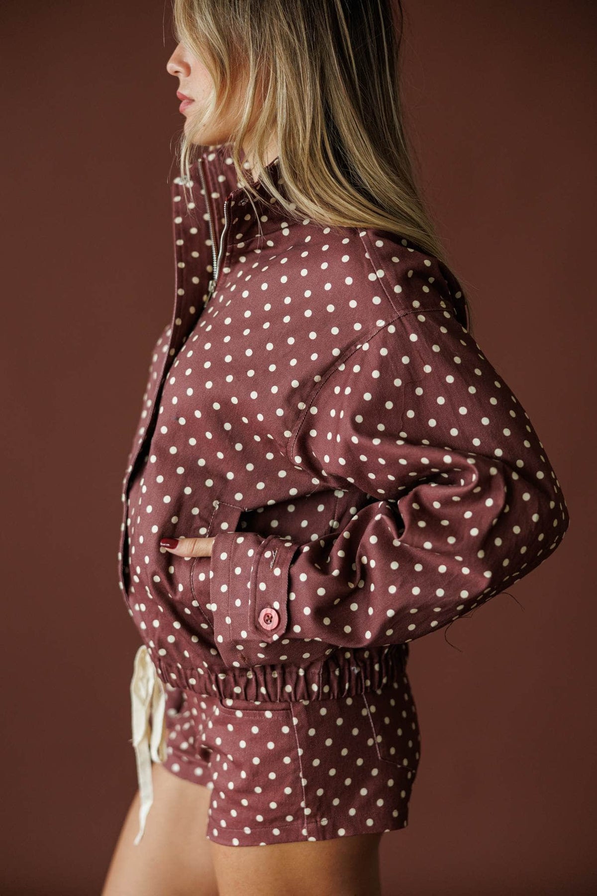 Cocoa Dot Lounge Jacket in hot chocolate, side view showing the balloon sleeve and drawstring hem