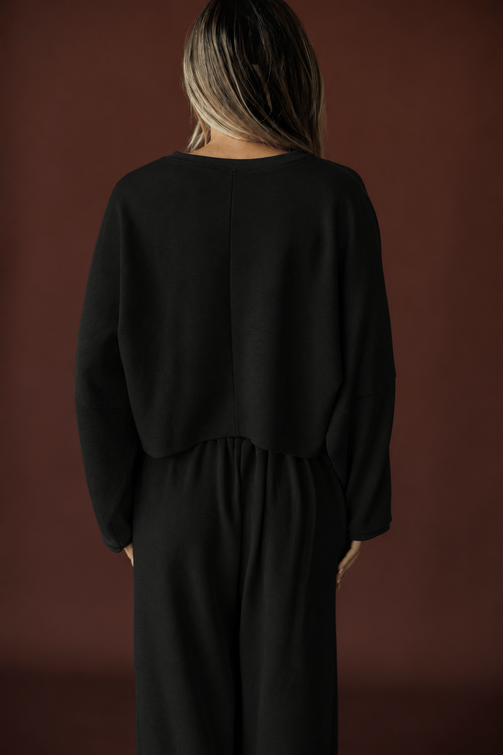 Cropped Scuba Dolman Top in black, back view showing the boxy cropped scuba knit