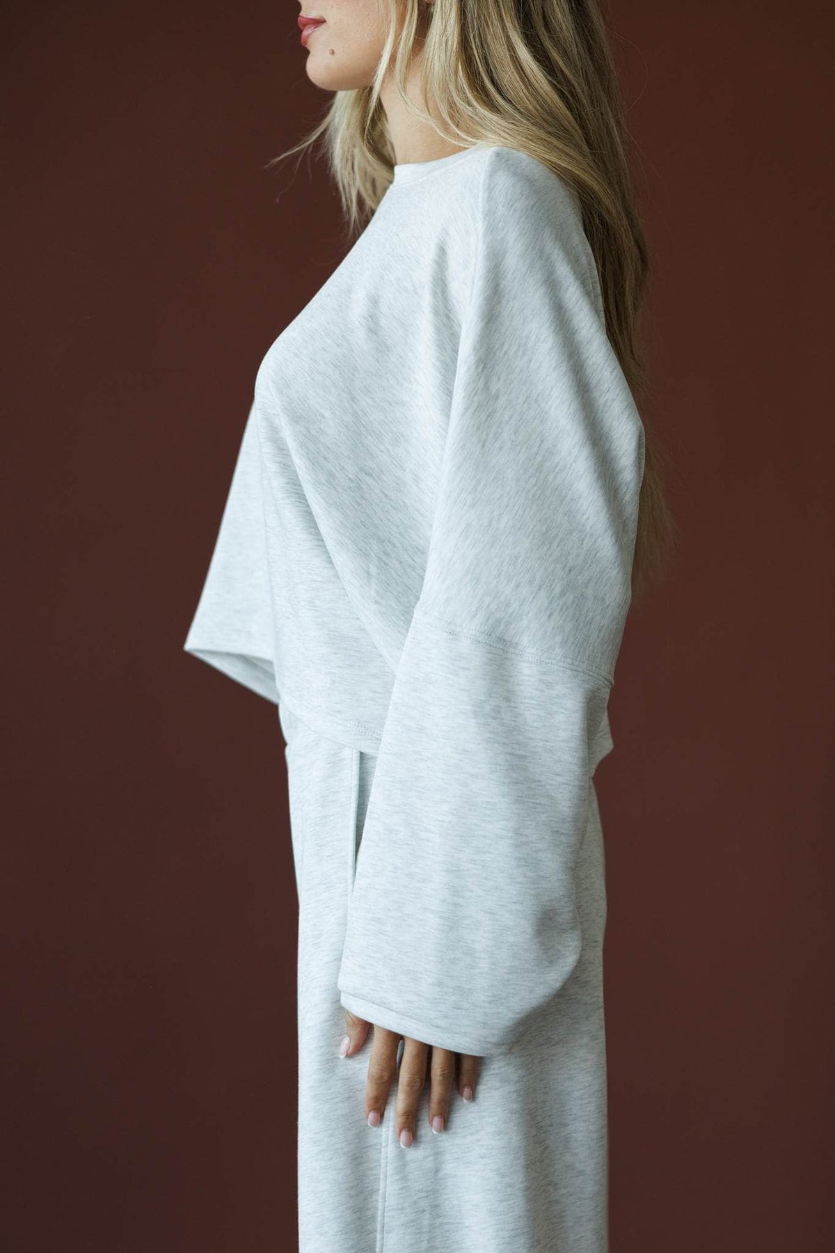 Cropped Scuba Dolman Top in ash grey, side view showing the wide dolman sleeve
