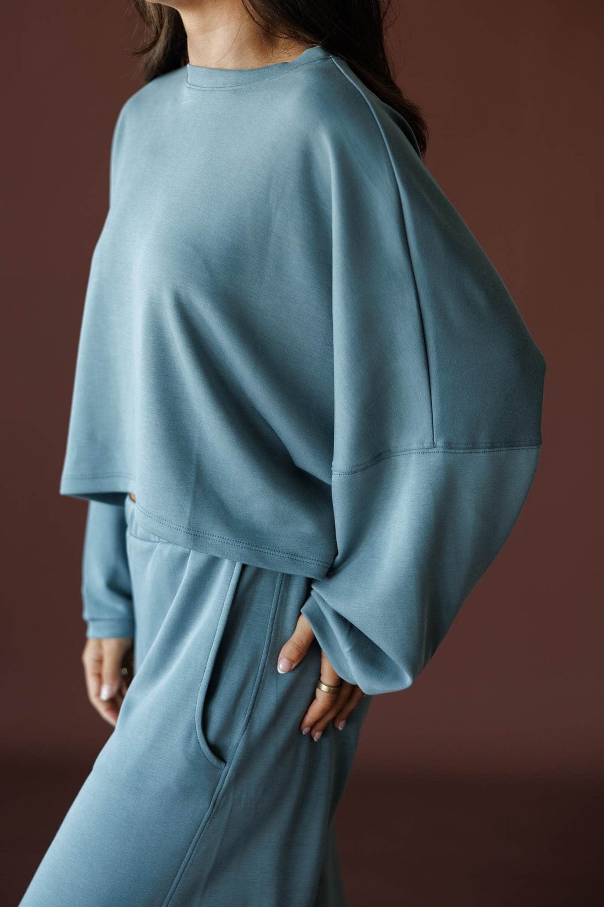 Cropped Scuba Dolman Top in charcoal, side view showing the wide dolman sleeve