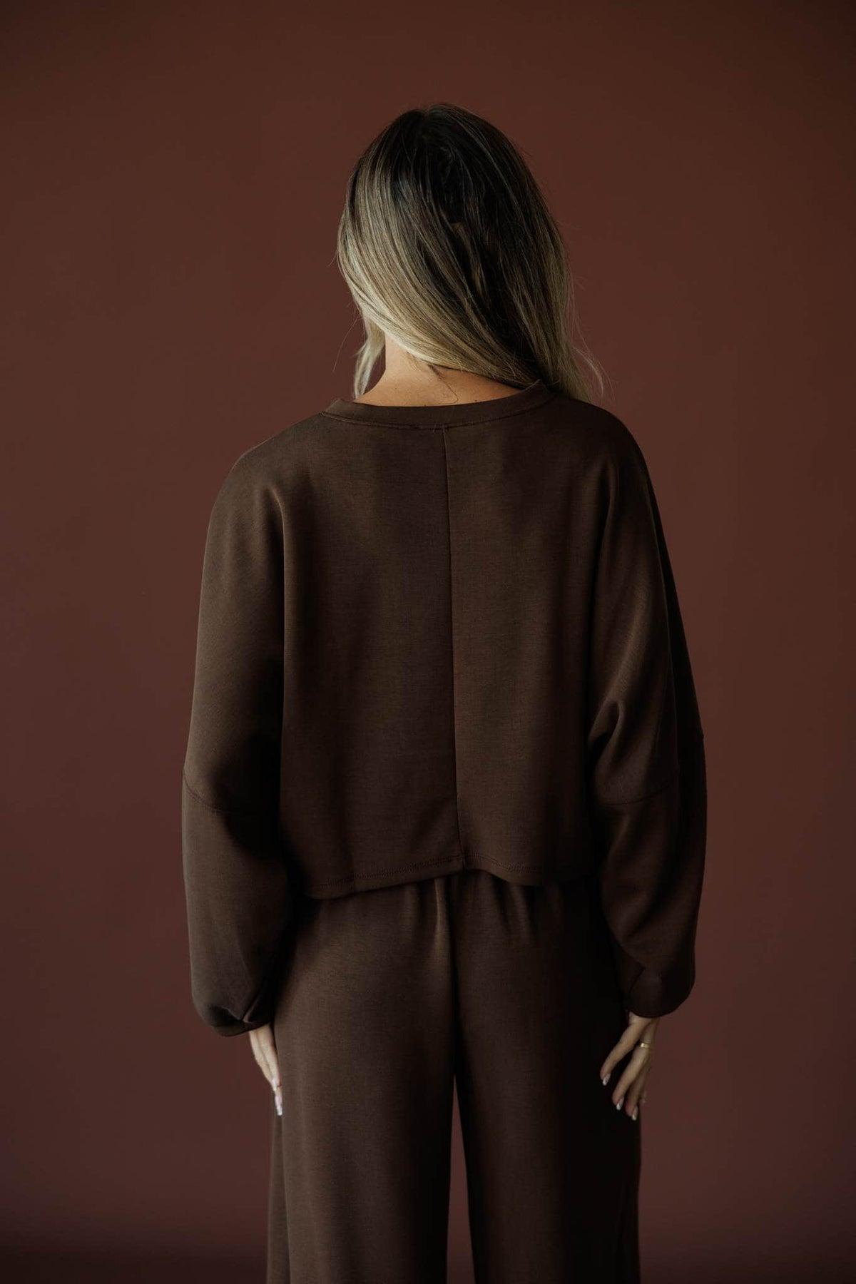 Cropped Scuba Dolman Top in brown, back view showing the boxy cropped scuba knit