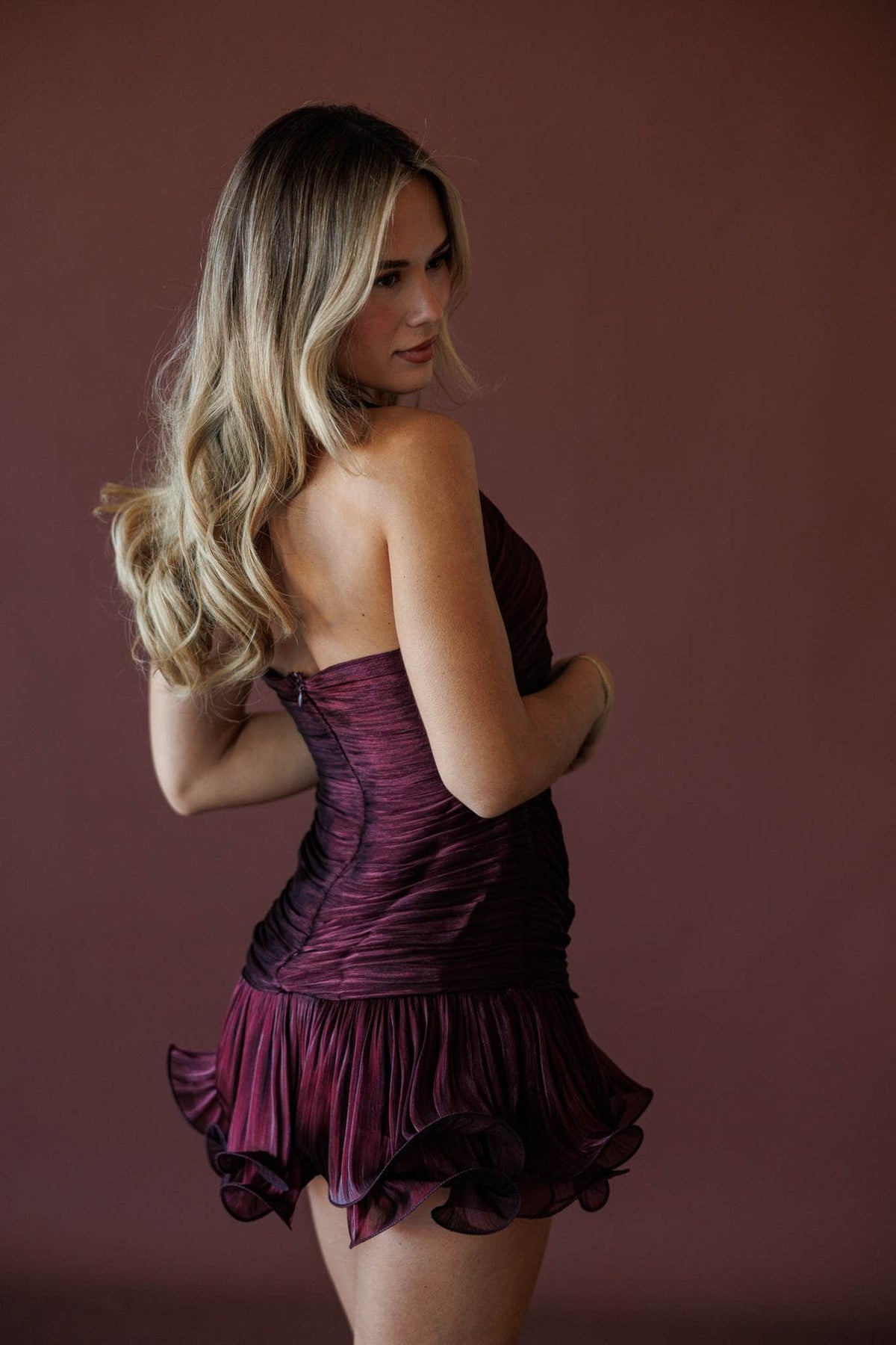 Dancing Till Sunrise Dress, in wine, side view of the ruffle hem