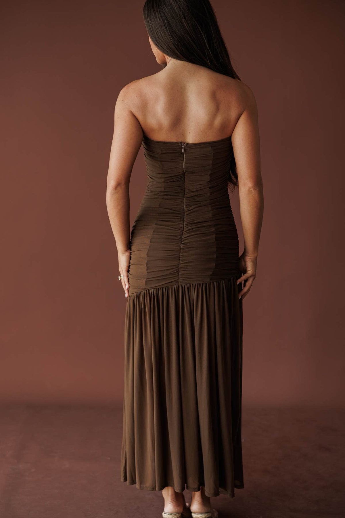 Back view of the mocha ruched strapless maxi dress and back zip