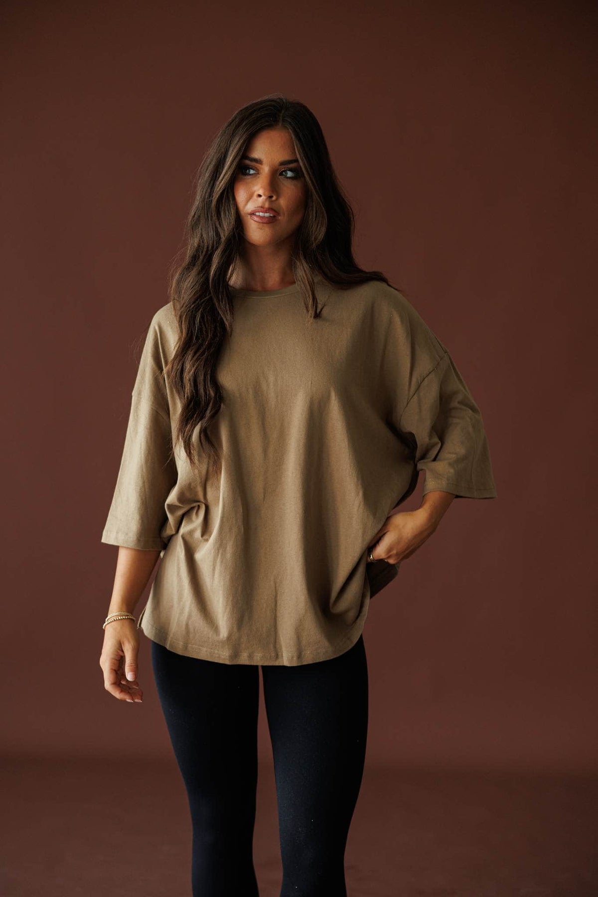 Day To Day Oversized Tee in khaki, front view on model with a hand in the pocket