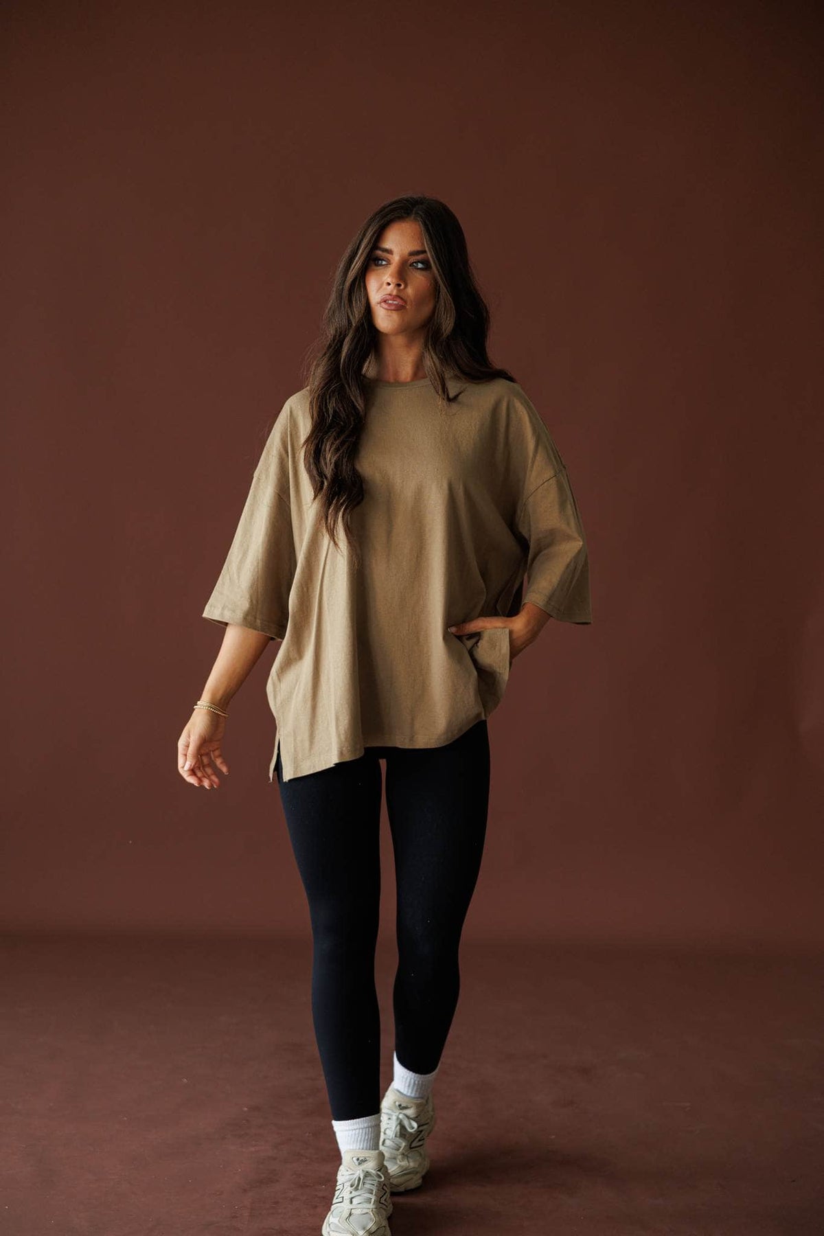 Day To Day Oversized Tee in khaki, full-length view with black leggings
