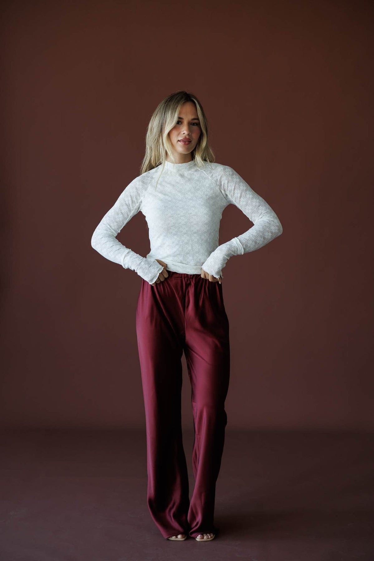 Delicate Matter Lace Top in cream, full-length view on model with hands on hips