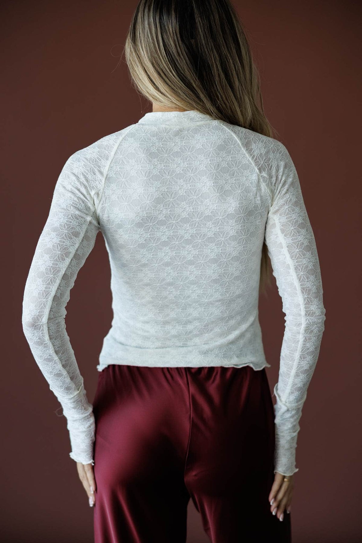 Delicate Matter Lace Top in cream, back view showing the fitted lace knit