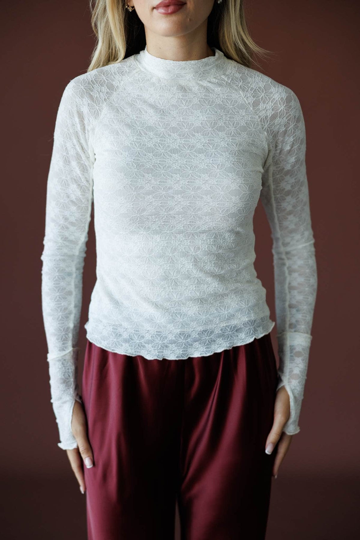 Delicate Matter Lace Top in cream, front close-up of the mock neck and textured lace