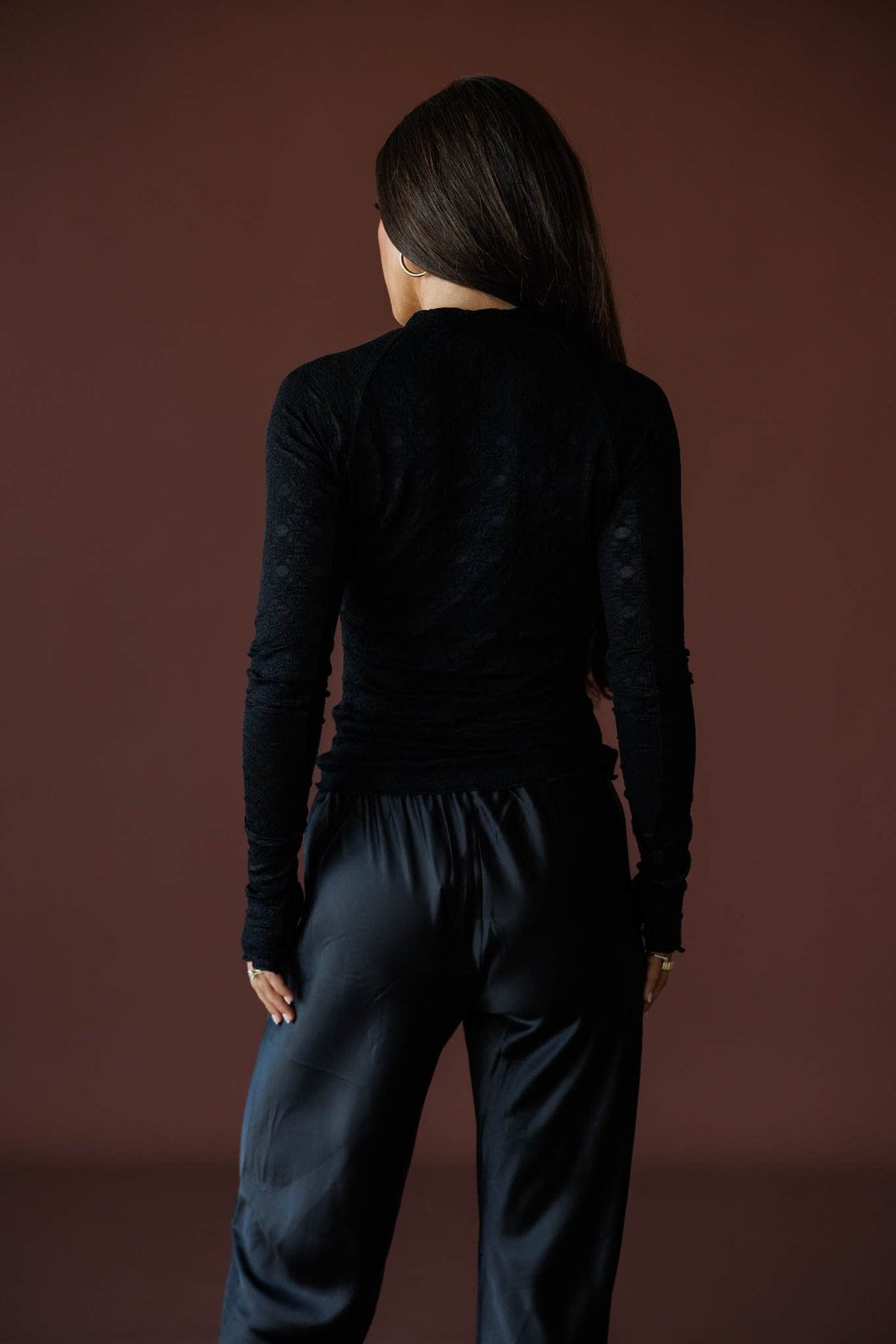 Delicate Matter Lace Top in black, back view showing the fitted lace knit