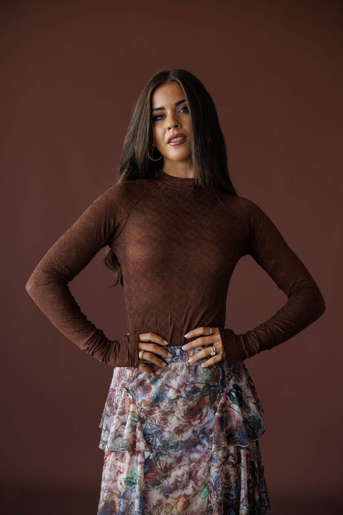 Delicate Matter Lace Top in chocolate, front view on model with hands on hips