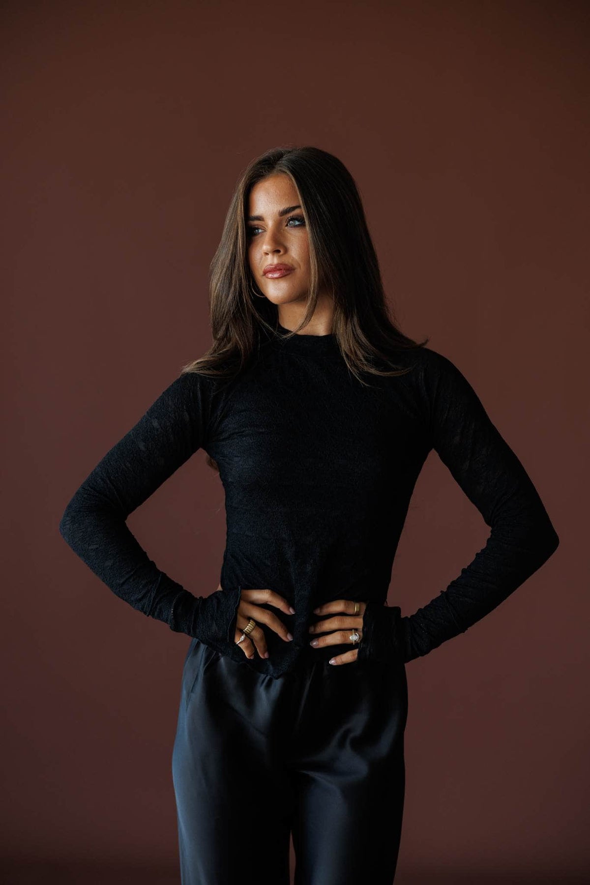 Delicate Matter Lace Top in black, full-length view with black satin wide leg pants