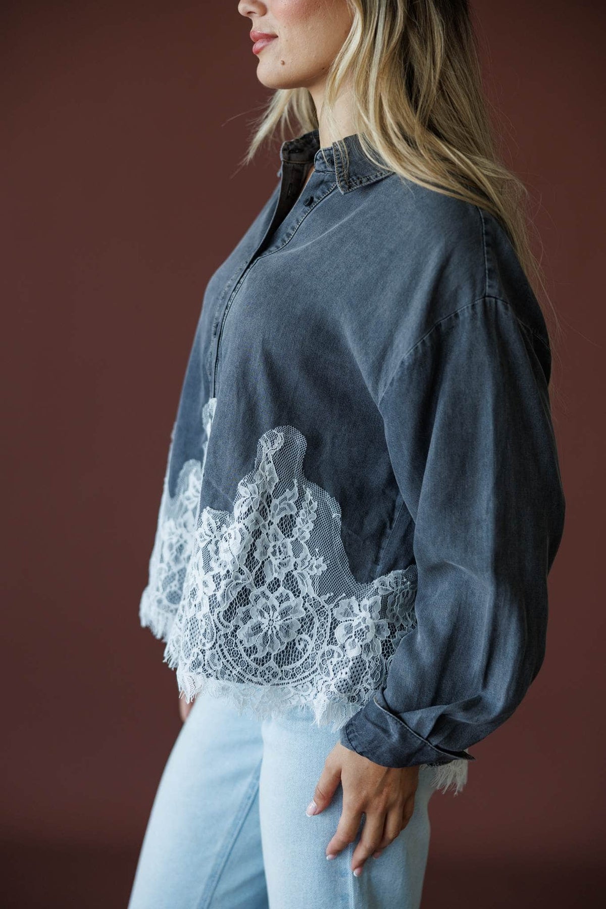 Denim And Delicate Top in black chambray, side view showing the balloon sleeve and lace