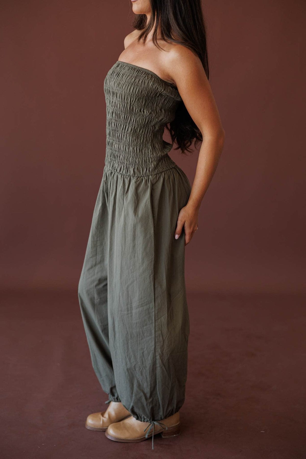 Evening Event Wide Leg Jumpsuit, in olive, side view of the smocked bodice and dropped waist