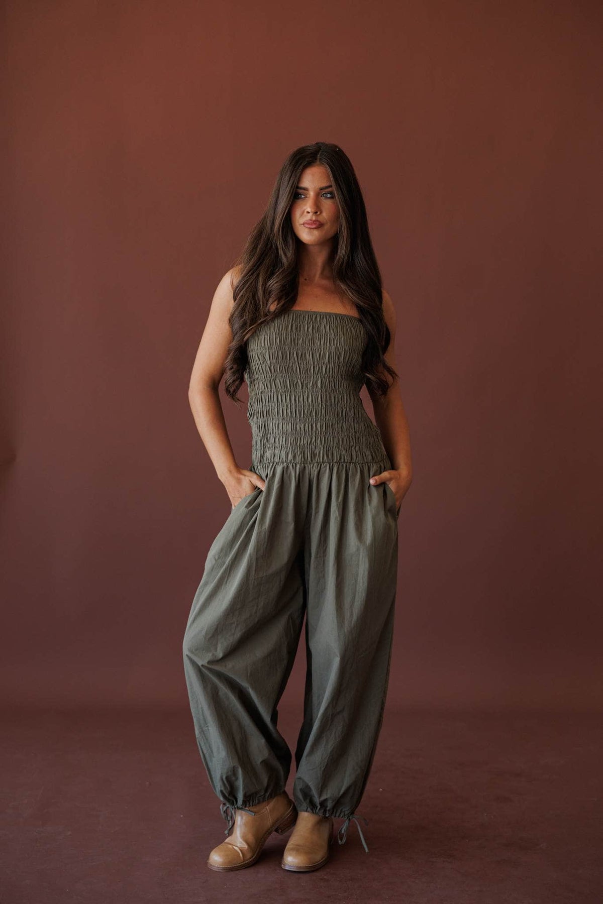 Evening Event Wide Leg Jumpsuit, in olive, full-length front view with hands in the side pockets