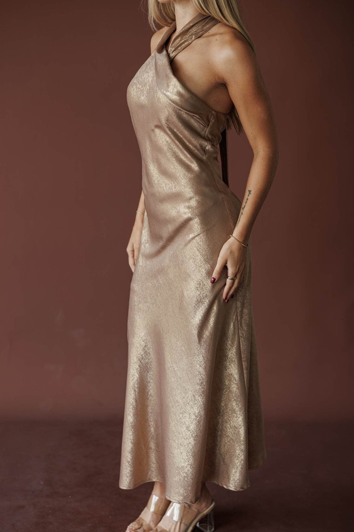 Bubbly Satin One Shoulder Maxi, in gold, side view of the bias skirt