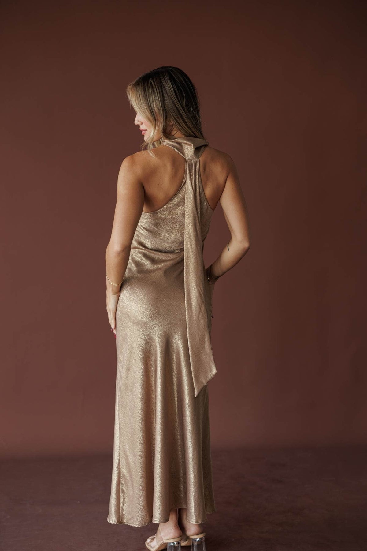 Bubbly Satin One Shoulder Maxi, in gold, back view of the draped sash