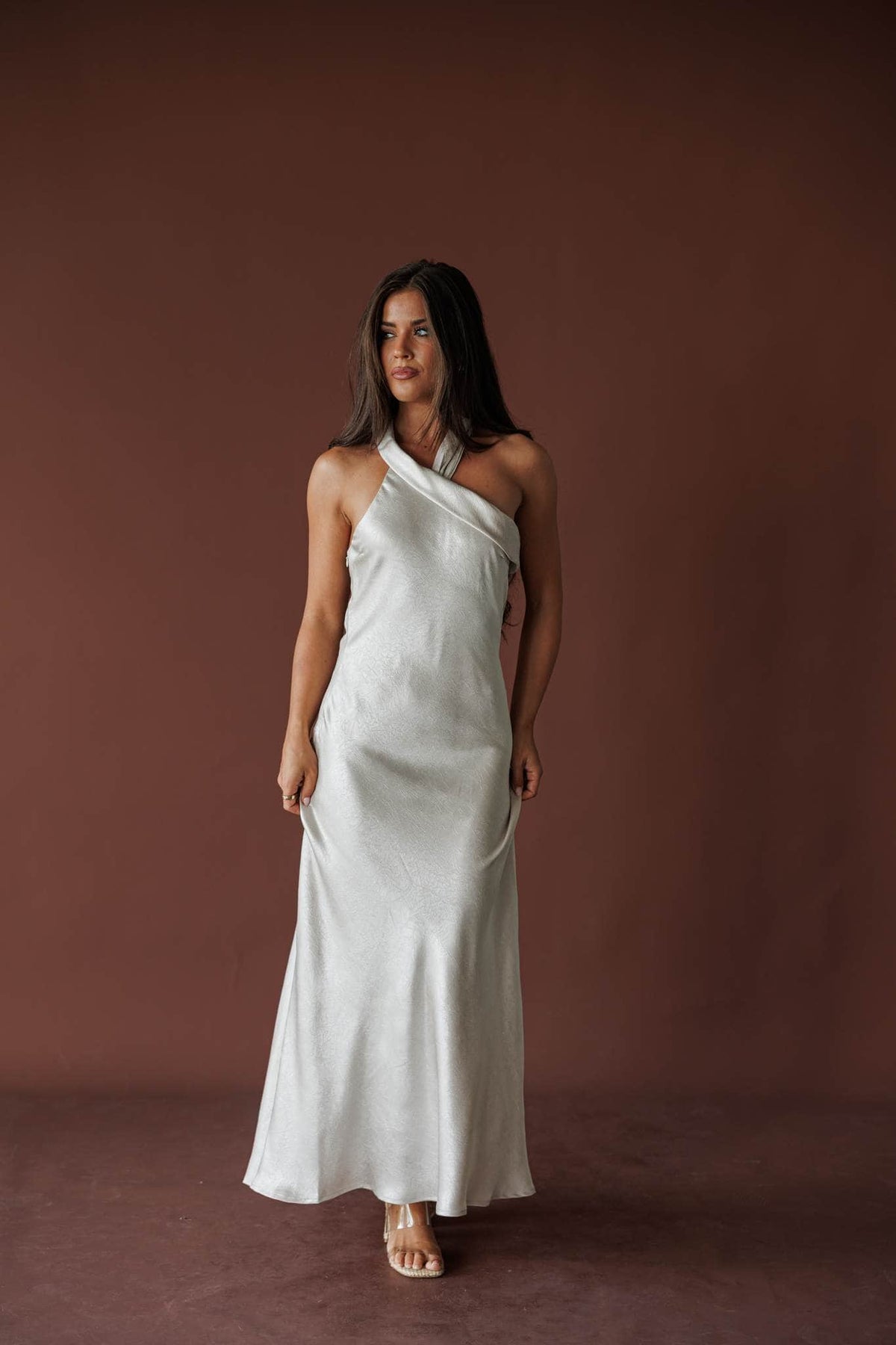Moonlight Satin Halter Maxi, in silverlight, three-quarter front view of the crossed halter neckline