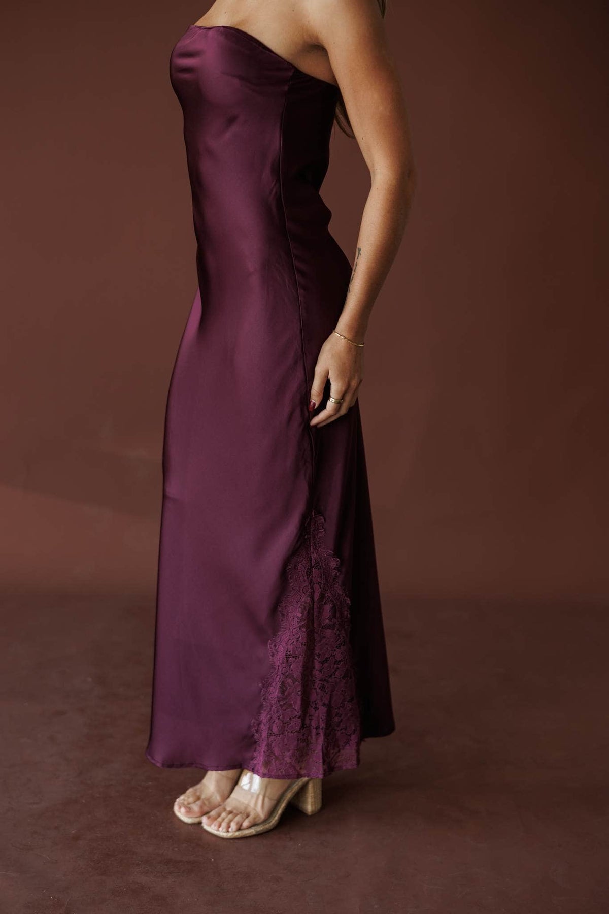 Aubergine Strapless Maxi, in deep plum, side view of the bias skirt