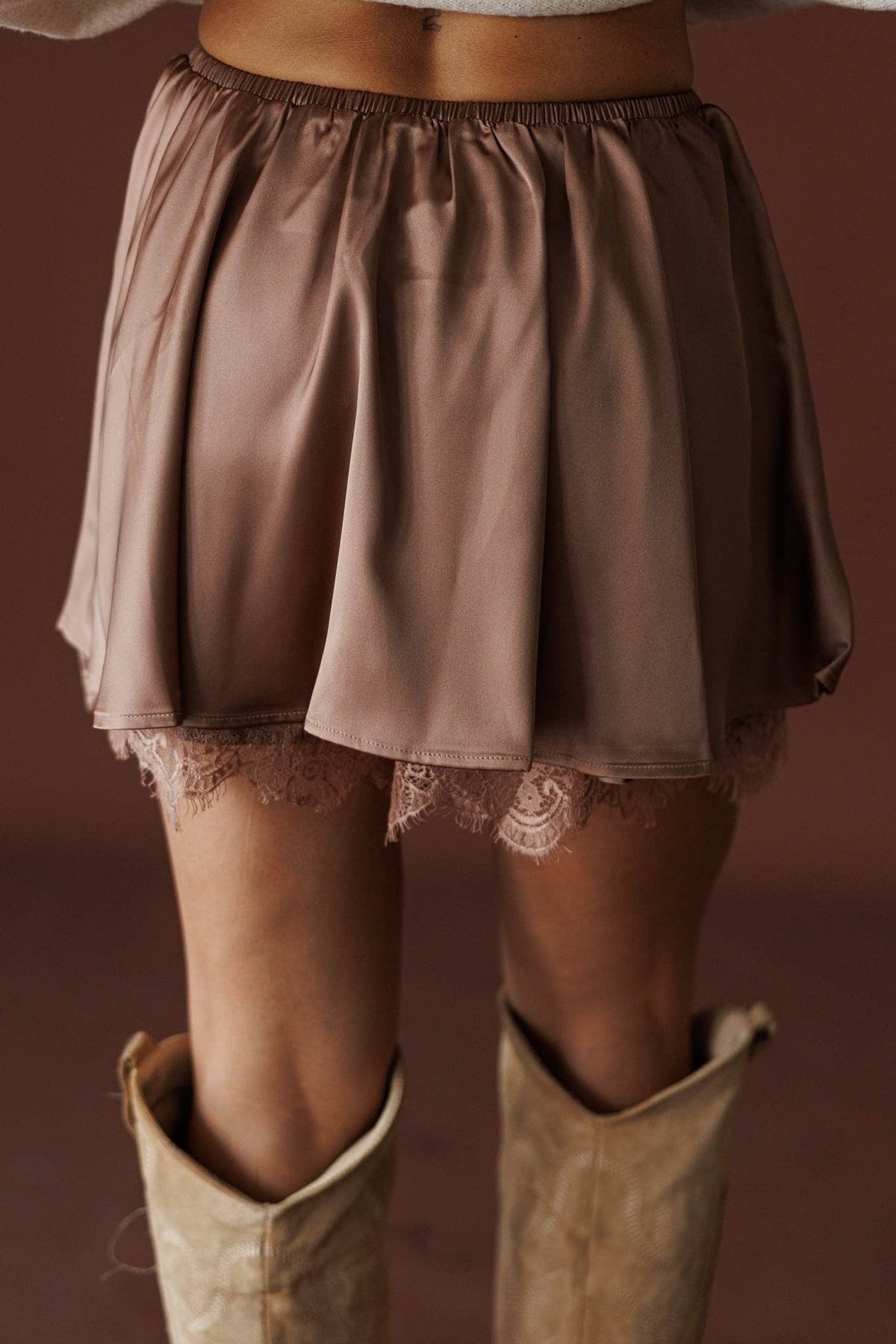 Satin And Lace Skort in bronze, back view of the drawcord waist and lace hem