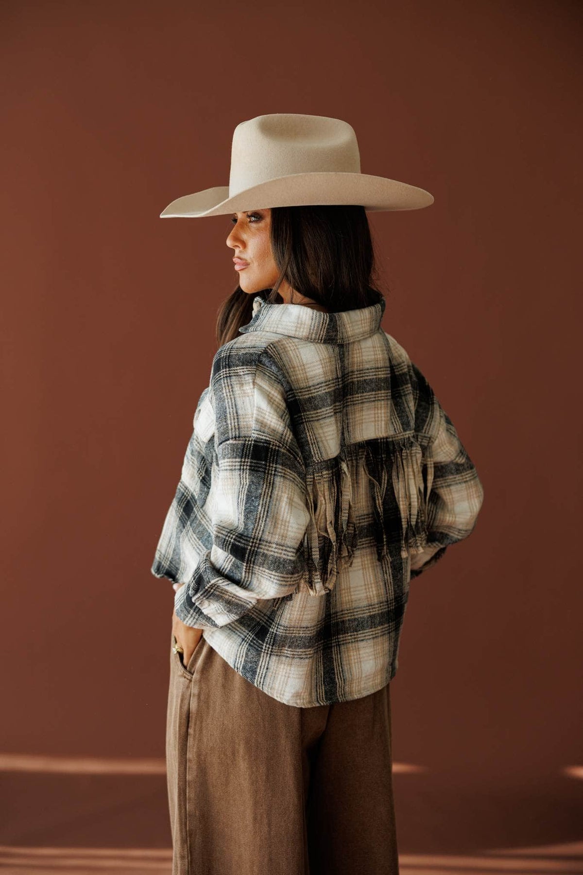 Fringe Lane Plaid Shacket in ivory and black, side view showing the fringe sleeve