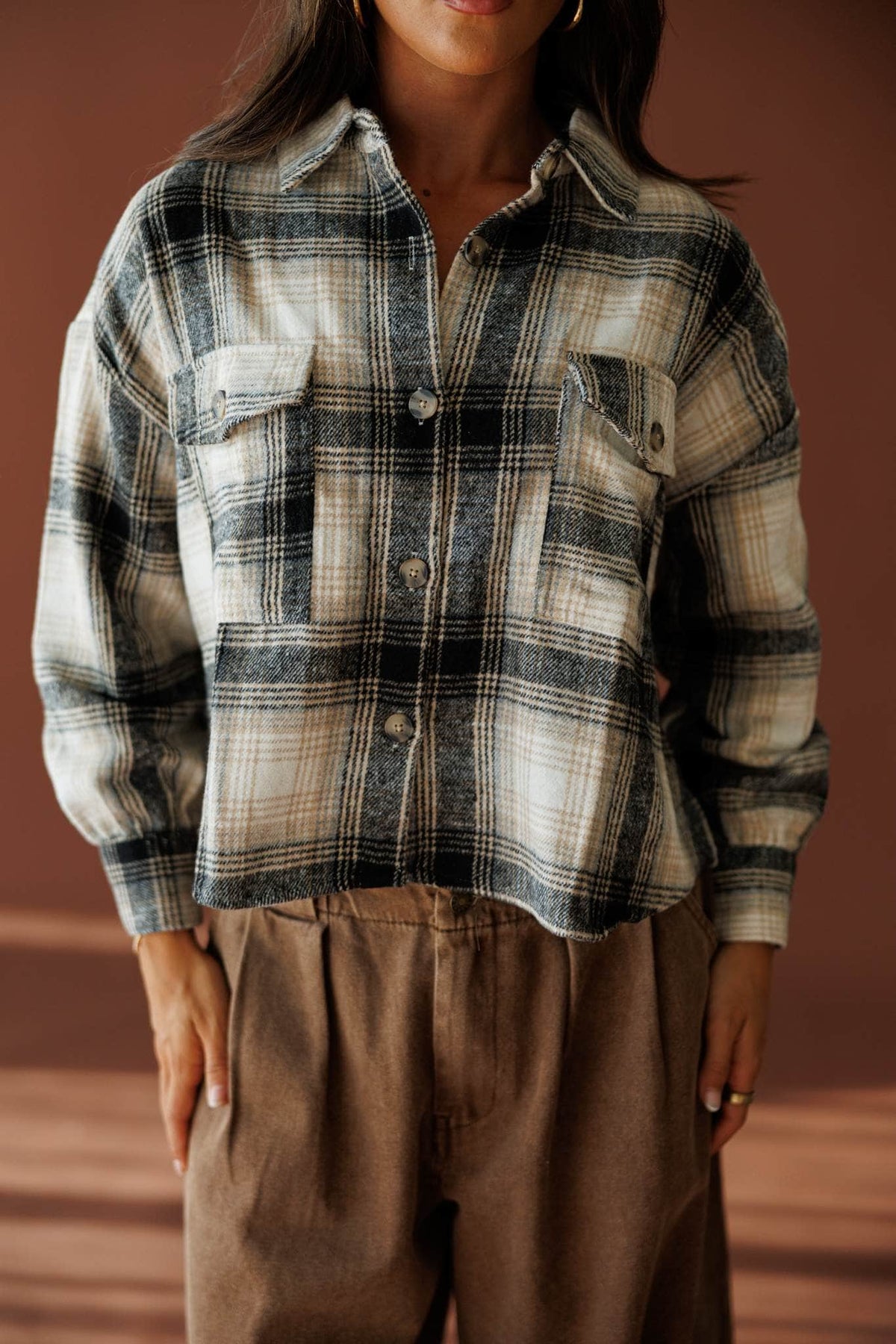 Fringe Lane Plaid Shacket in ivory and black, front close-up of the button front plaid